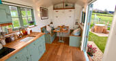 Oak Hut at Shropshire Shepherds Huts dining area that converts into a double bed